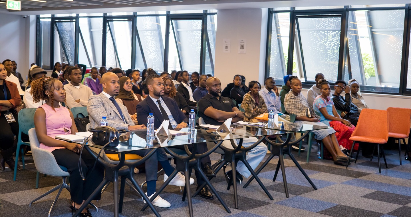 Judges and the audience seated during pitch sessions at the summit
